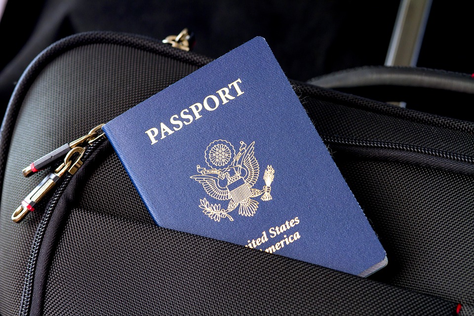 Image with a suitcase and a passport in the front pocket